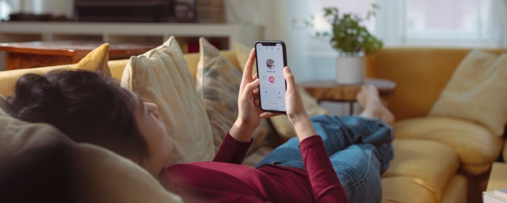 Why is Tinder so successful? Lady checking Tinder app